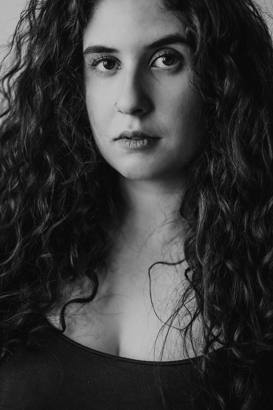a woman with long curly hair