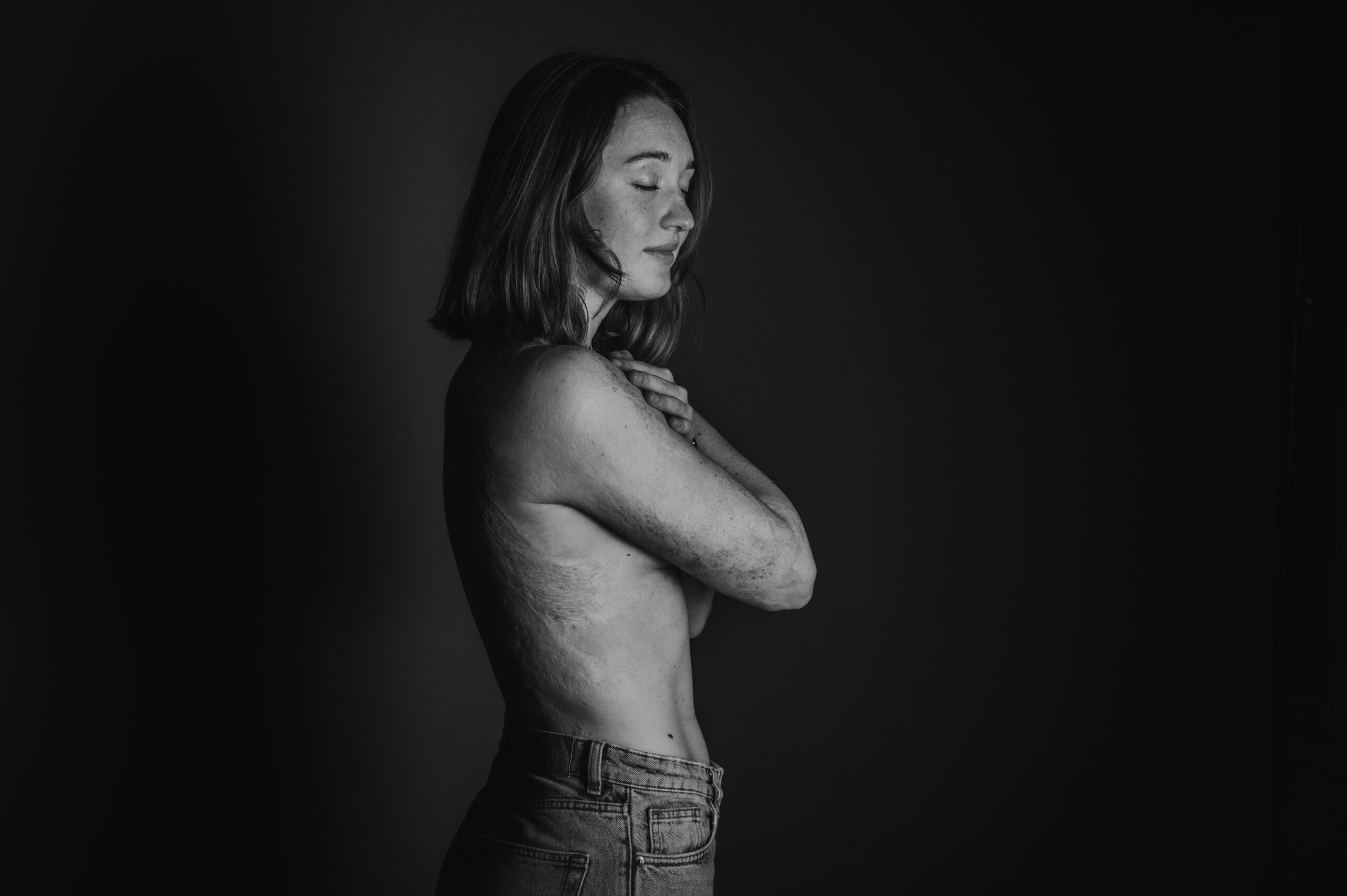 a woman with her arms crossed